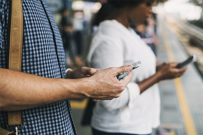 People using smartphones credit rawpixel.com