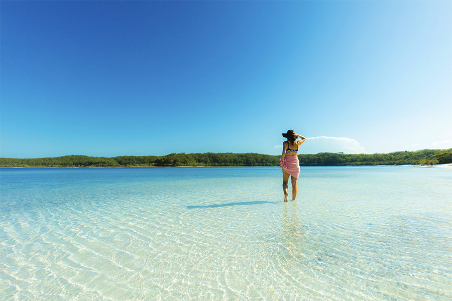 Girl standing in Lake McKenzie Fraser Island credit Jules Ingall